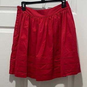 Banana Republic red pleated layered hem skirt.
